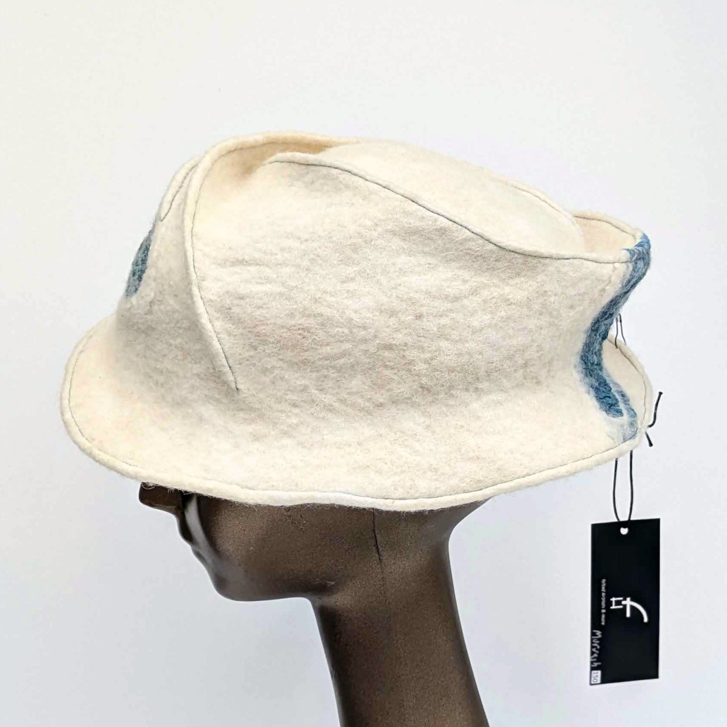 Cream coloured fedora on mannequin