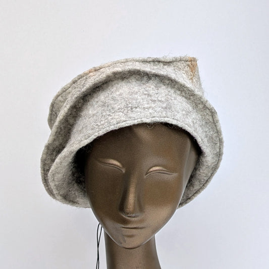 Light brown hat with stitched folds on a mannequin