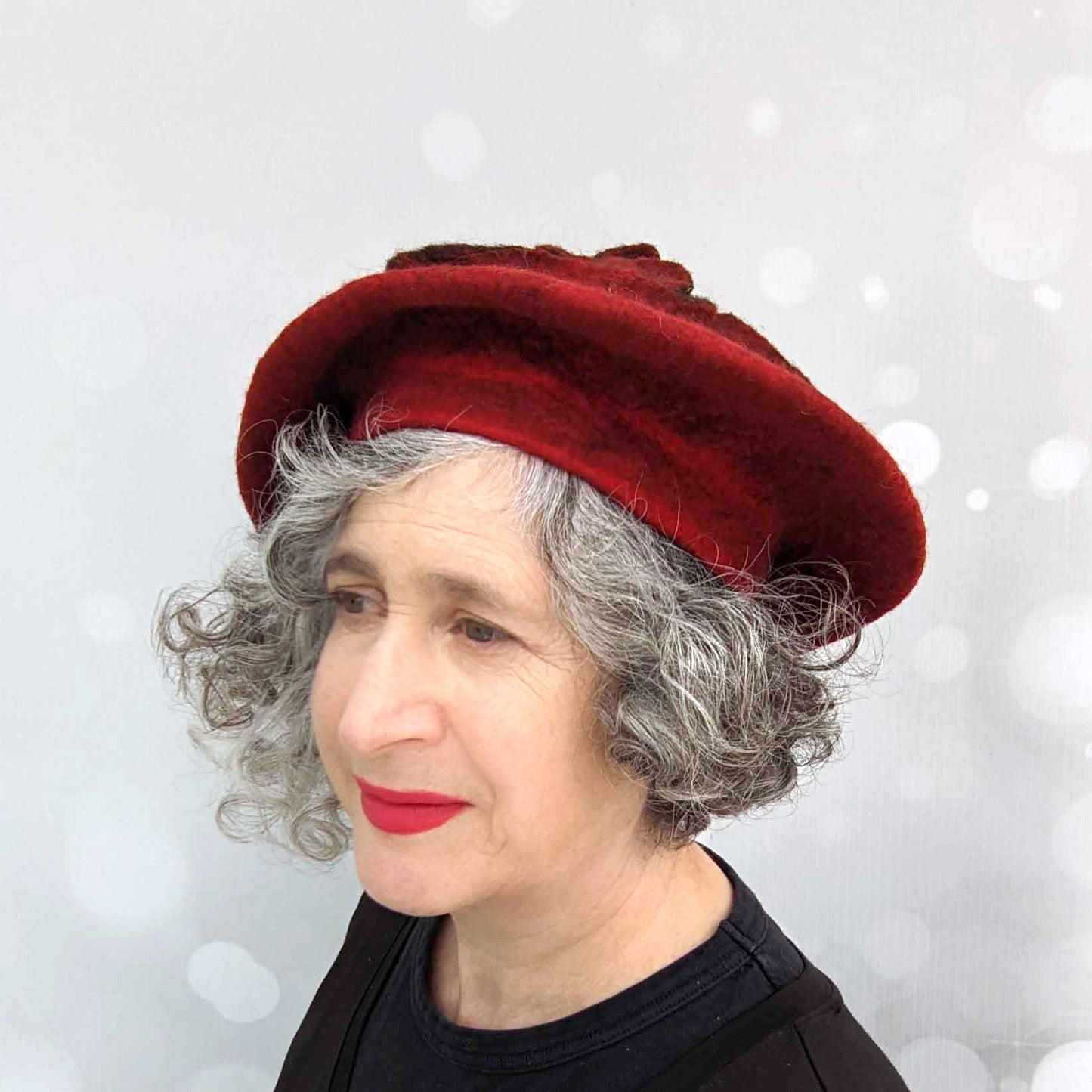 Felted Red Beret with Triskele Motif -threequarters view