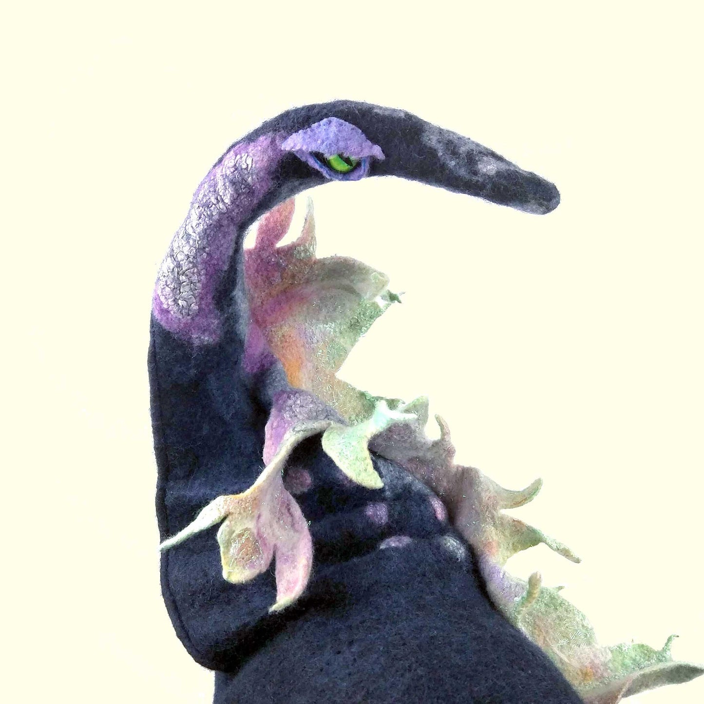 Felted Witch Hat with Iridescent Rainbow Dragon - closeup of green colored, glass dragon eye