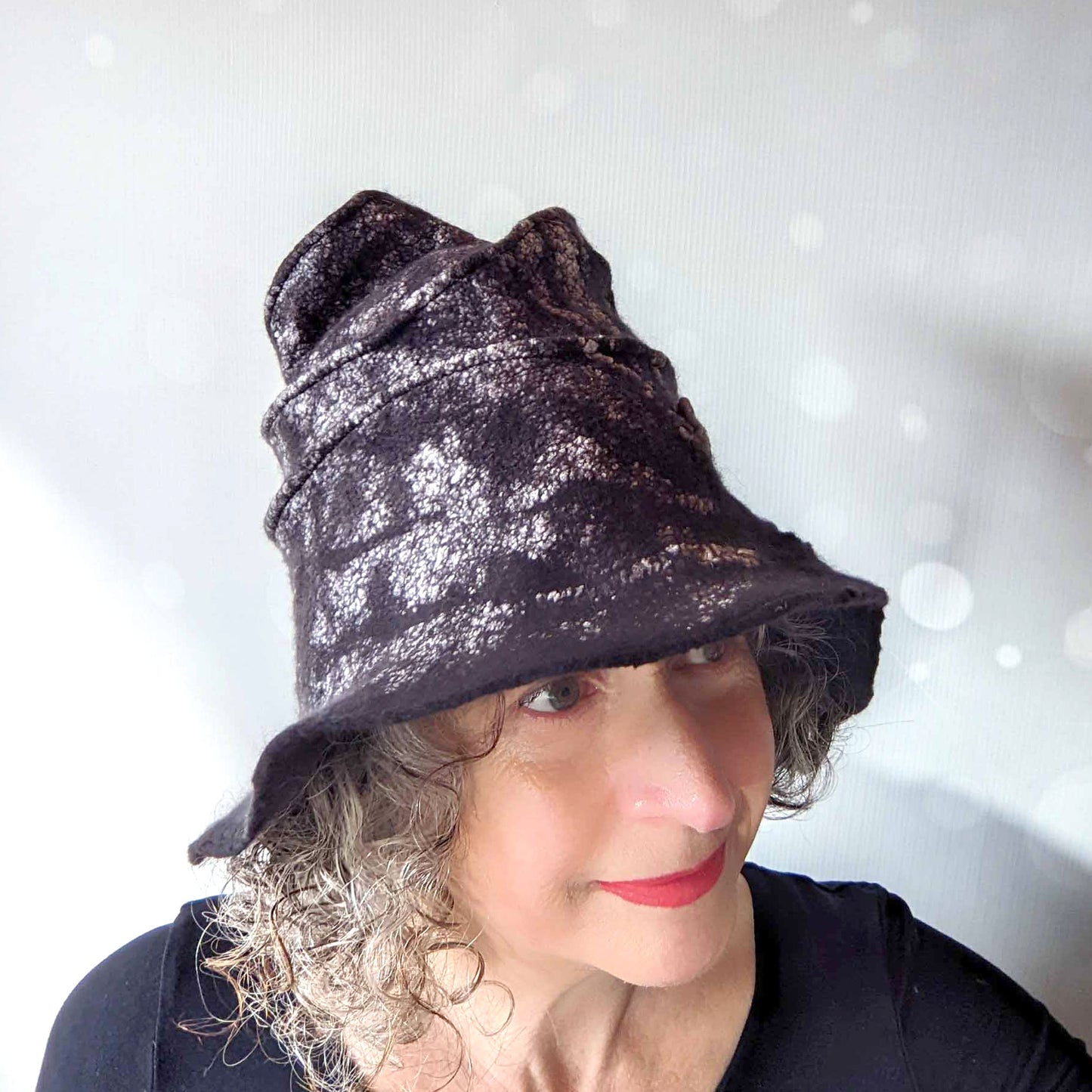 Nunofelted Black Hat with Brim and Organic Shaped Tip - threequartersview