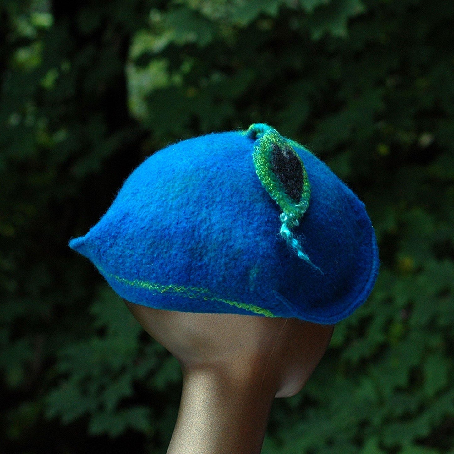 Teal Felted Cap with Stylized Peacock Feathers - back view