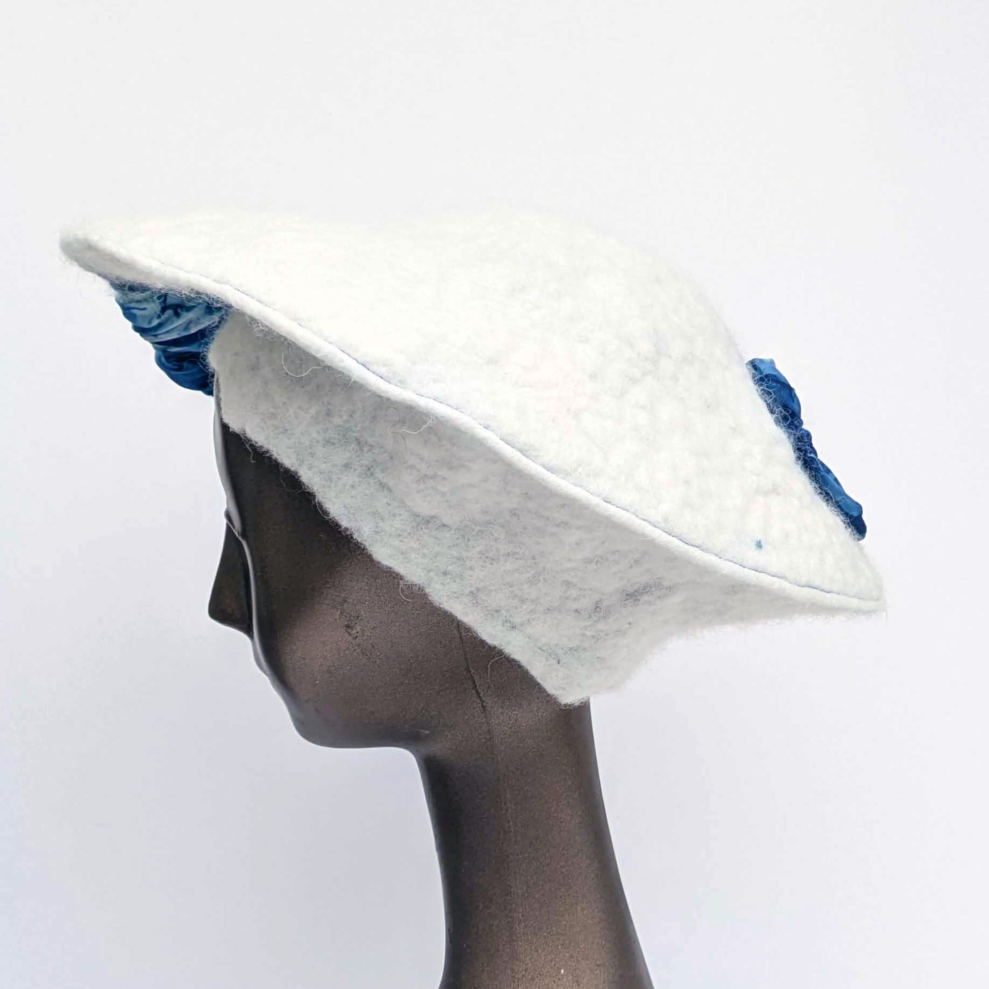 White felted saucer hat with cyanotype printed blue ruched fabric -sideview