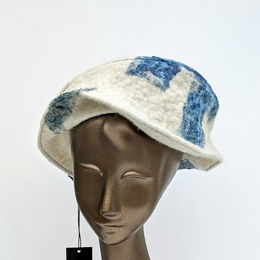 Creamy white hat with a small, asymetrical brim.
