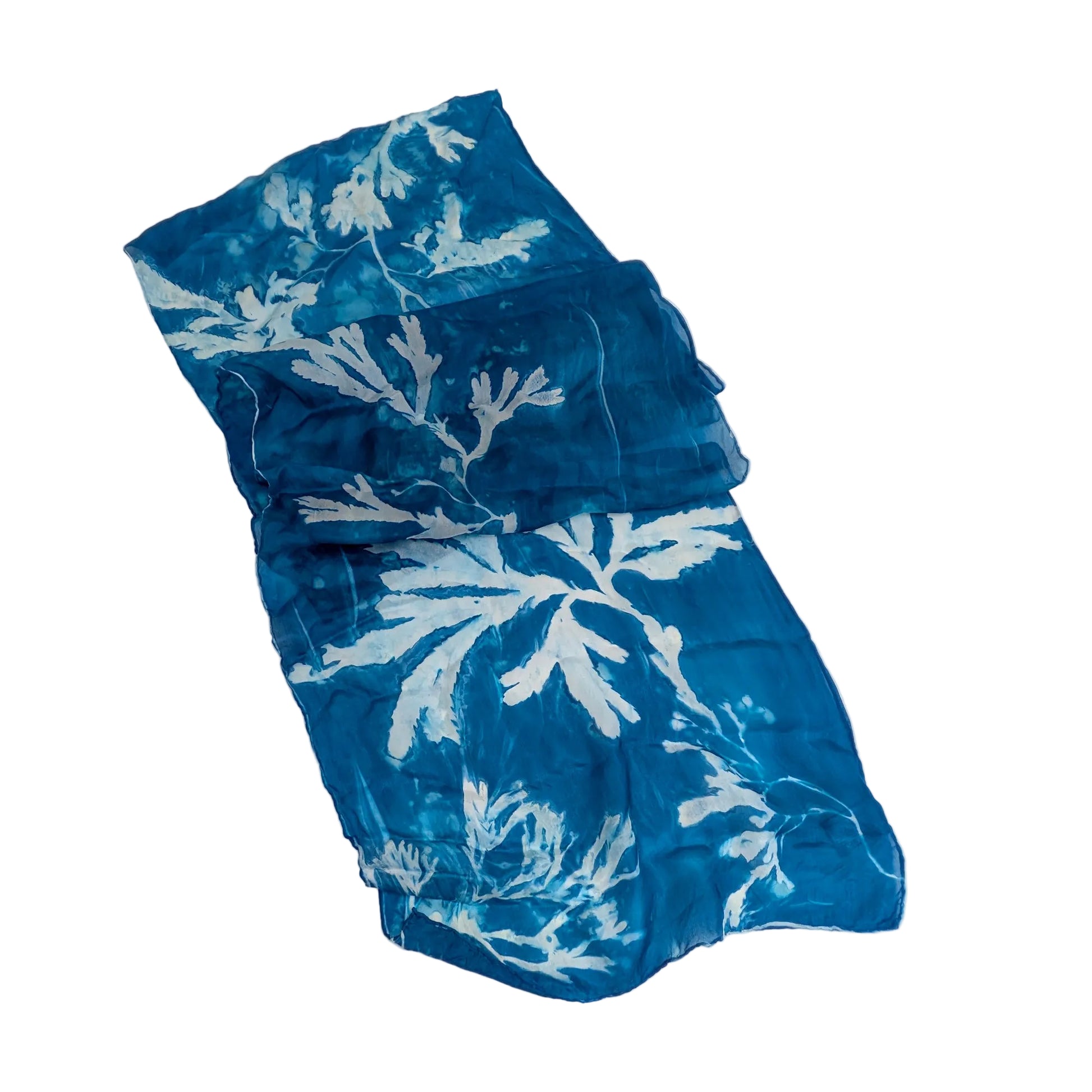 Blue scarf with white seaweed botanical pattern on a white background