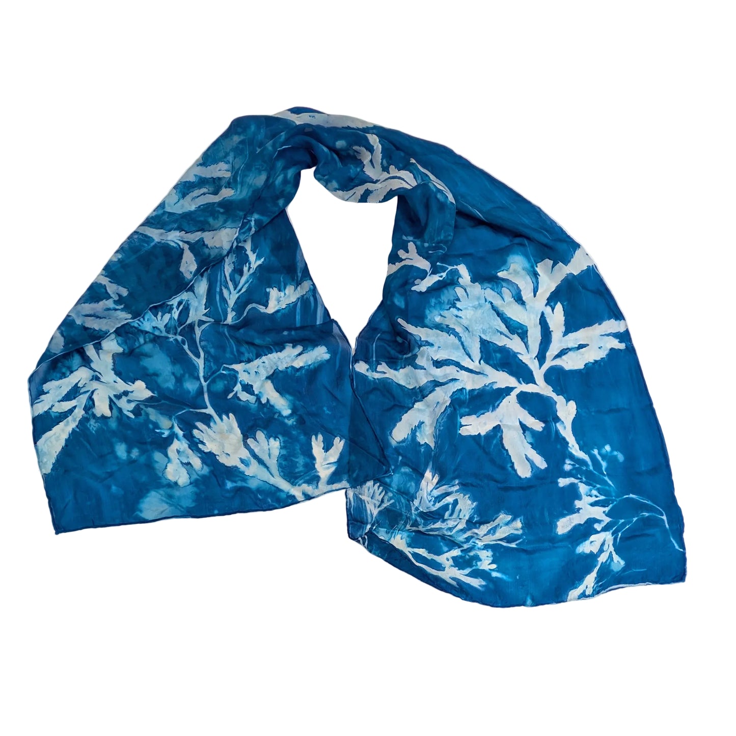 Blue and white seaweed-patterned scarf on a white background