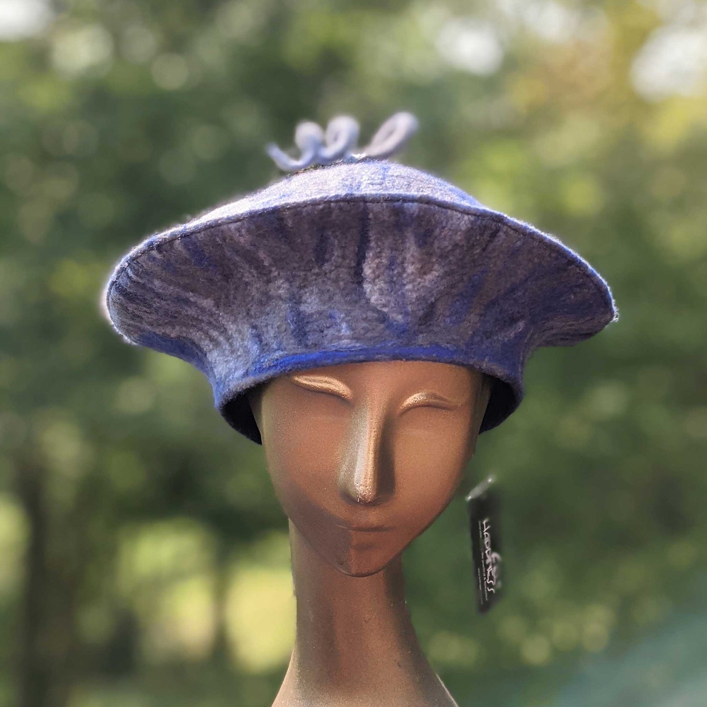 Blue and Gray Curlicue Beret - on mannequin head