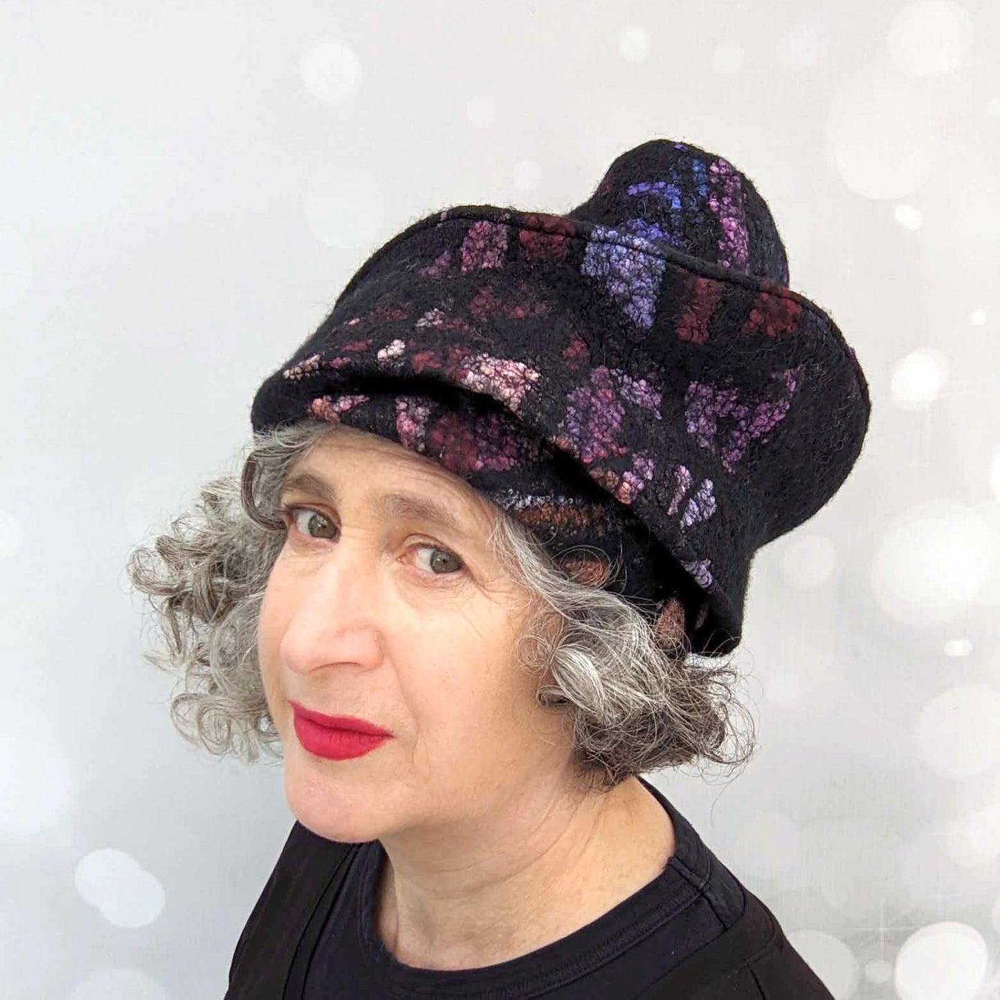 Felted Wool Toque in Black with Vibrant Stained Glass Colors - threequartersview