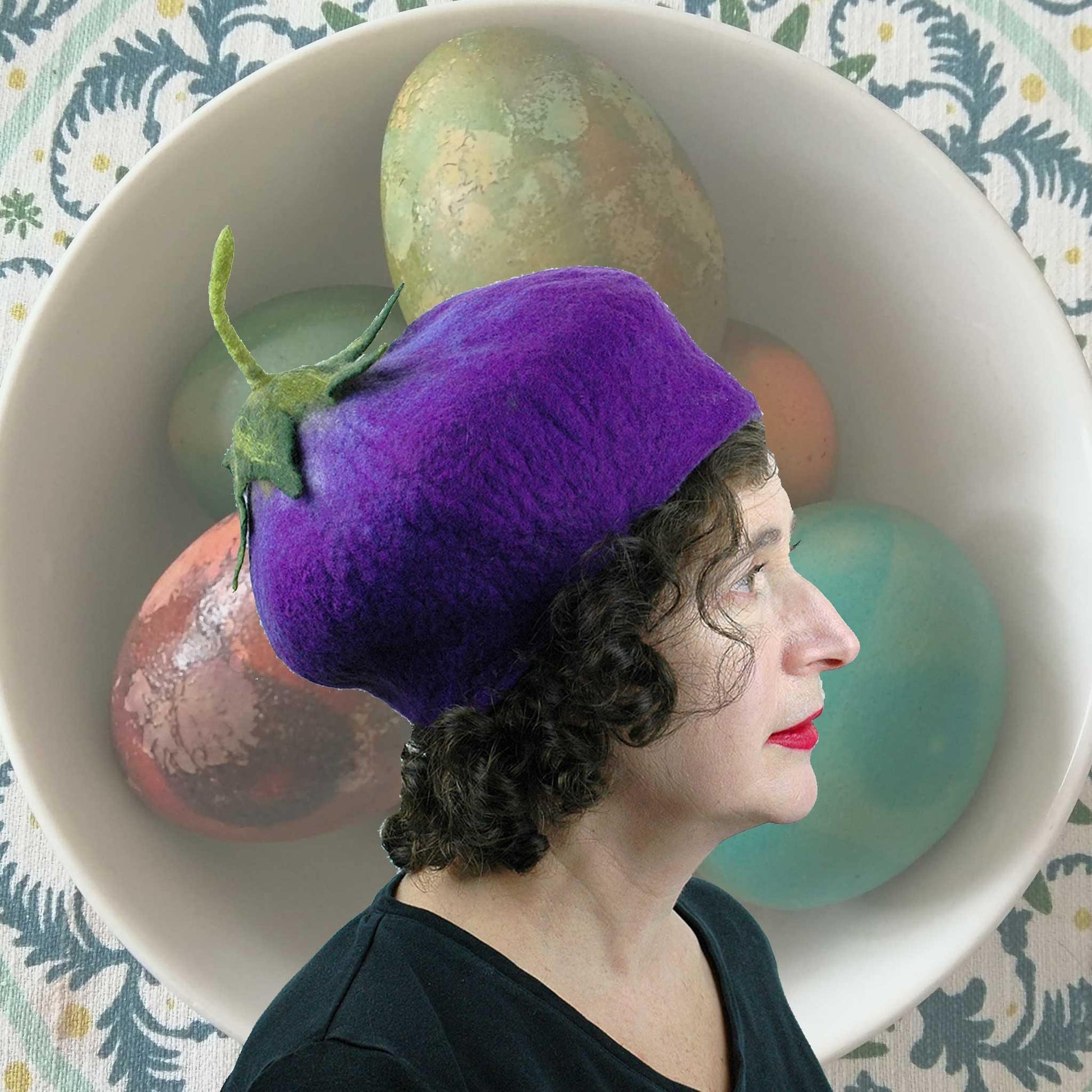 Purple Eggplant Felted Beret Hat with Easter Egg background.