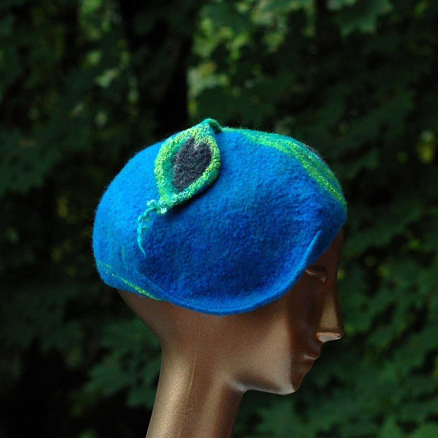 Teal Felted Cap with Stylized Peacock Feathers - side view
