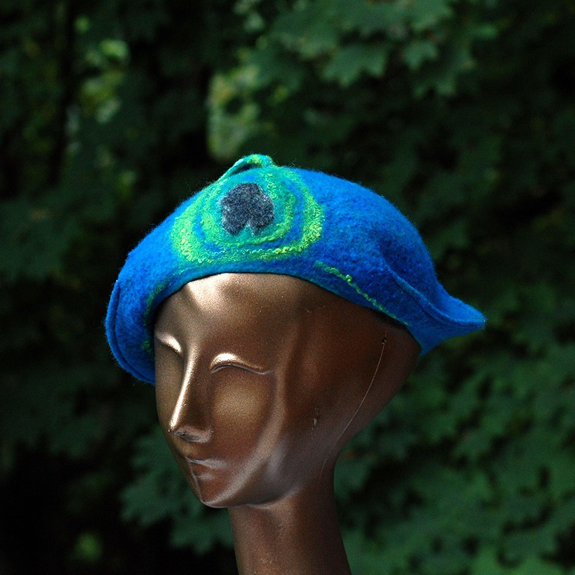 Teal Felted Cap with Stylized Peacock Feathers - three quarters view