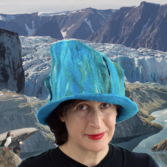 Turquoise blue and green felted fedora against Norwegian Fjords. Digital Collage.