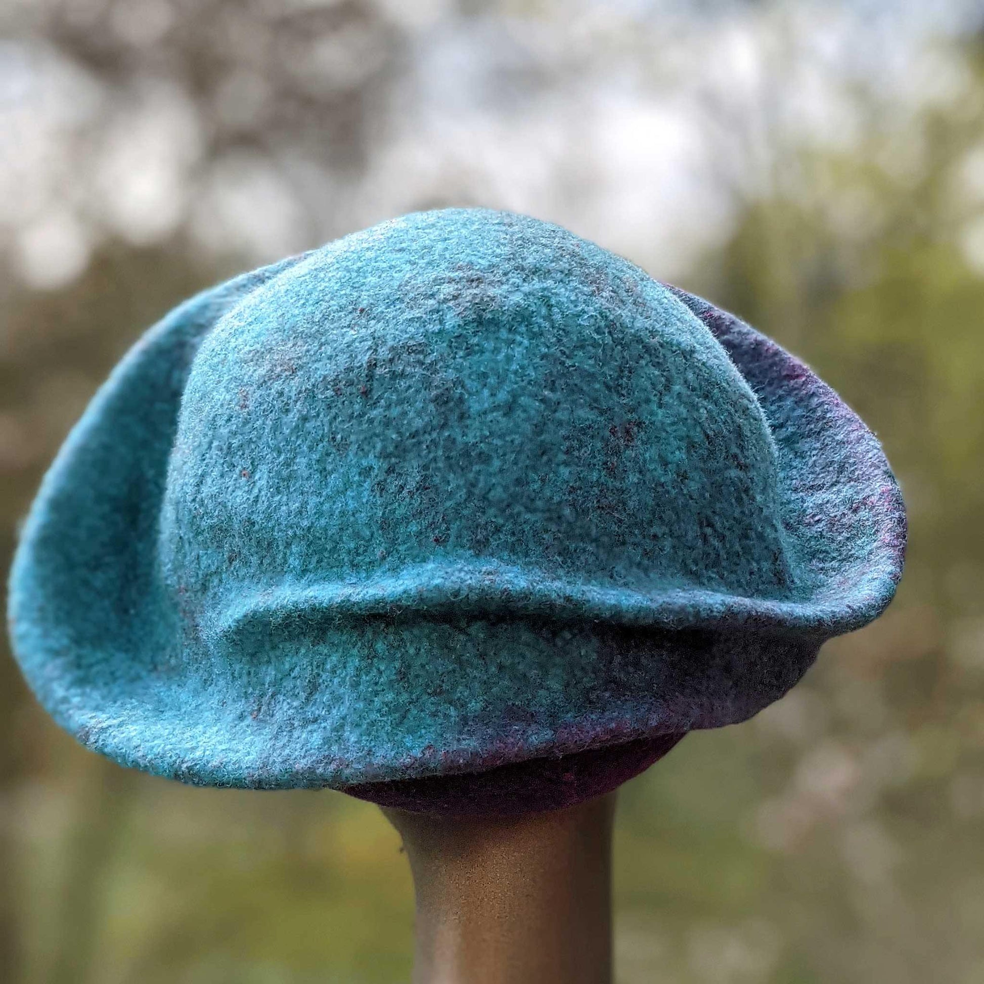 Undulating Spiral Hat in Blue-Green and Raspberry - back view
