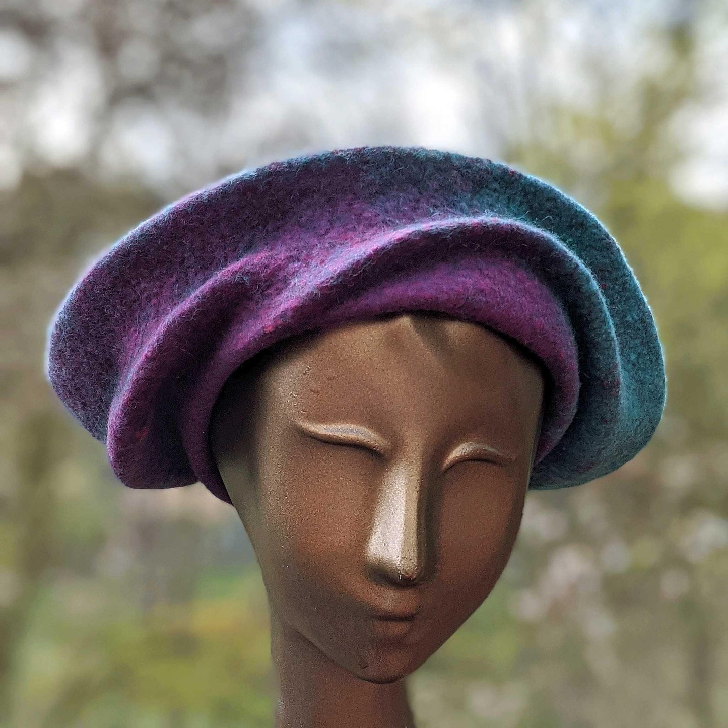 Undulating Spiral Hat in Blue-Green and Raspberry - front view